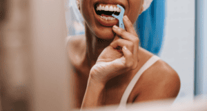 a woman flossing